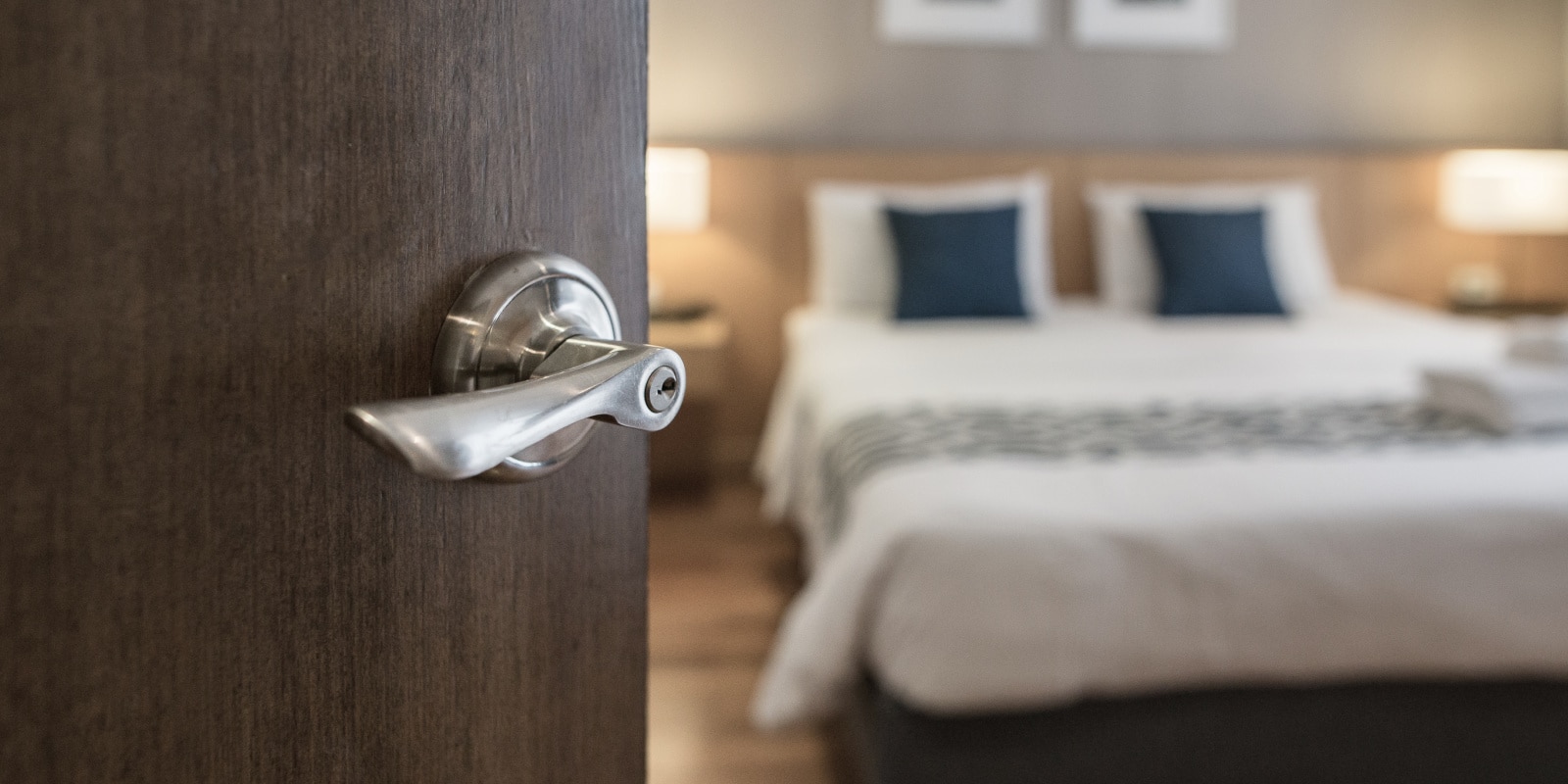 Door quietly opening into a bedroom