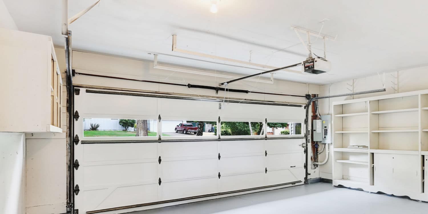 Inside a garage with white garage door