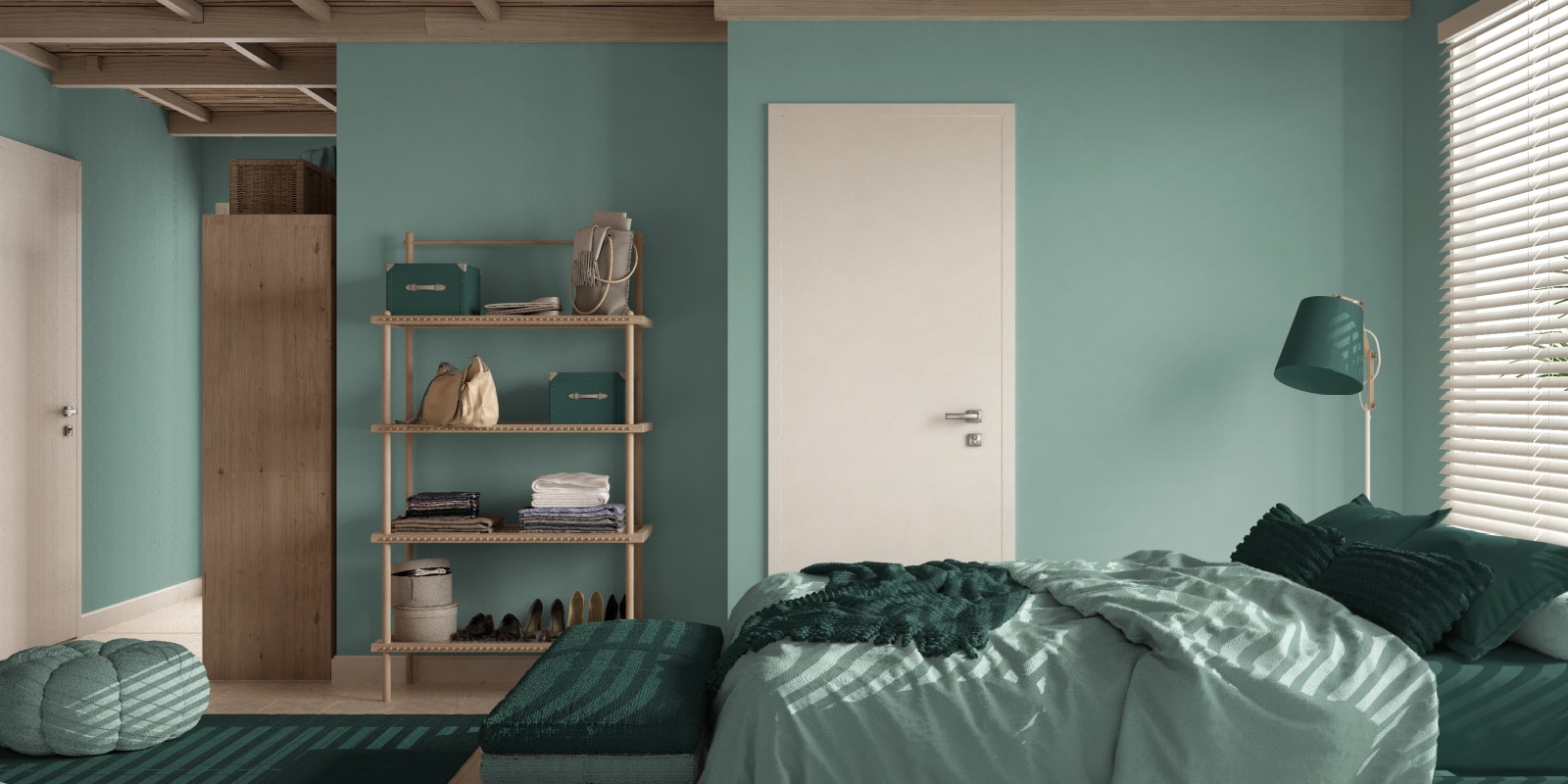 Cozy bedroom with teal colored walls and a white door
